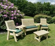 Churnet Valley Ergo Outdoor Coffee Table & 4 Seater Set in a garden, full image of the whole set as a collective