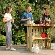 People gathered around the Folding Garden Bar
