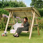 Lady sat on the Zest Miami 2 seater swing enjoying the sun